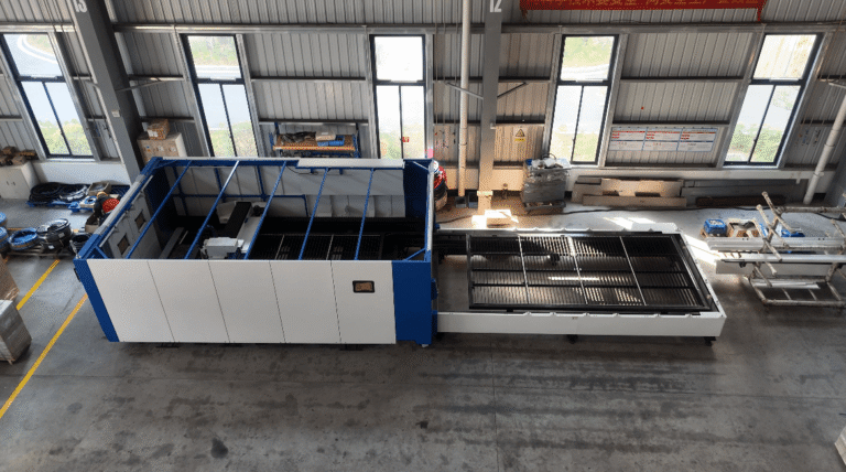 Fiber laser cutting machine with exchange table in workshop