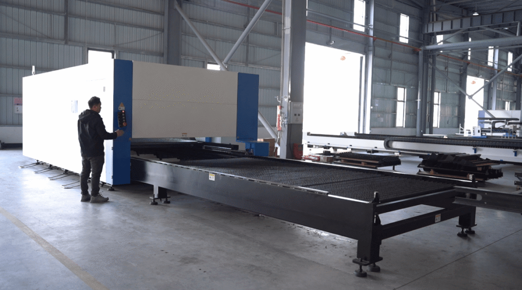 Worker Operating Industrial Laser Cutter