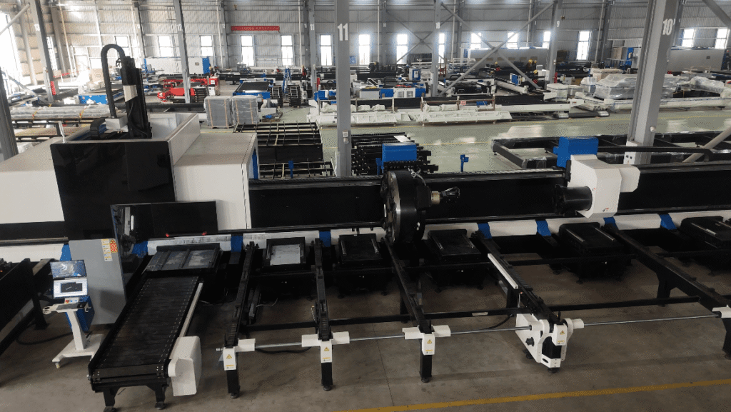 High-power laser cutting head piercing precise holes on a steel sheet