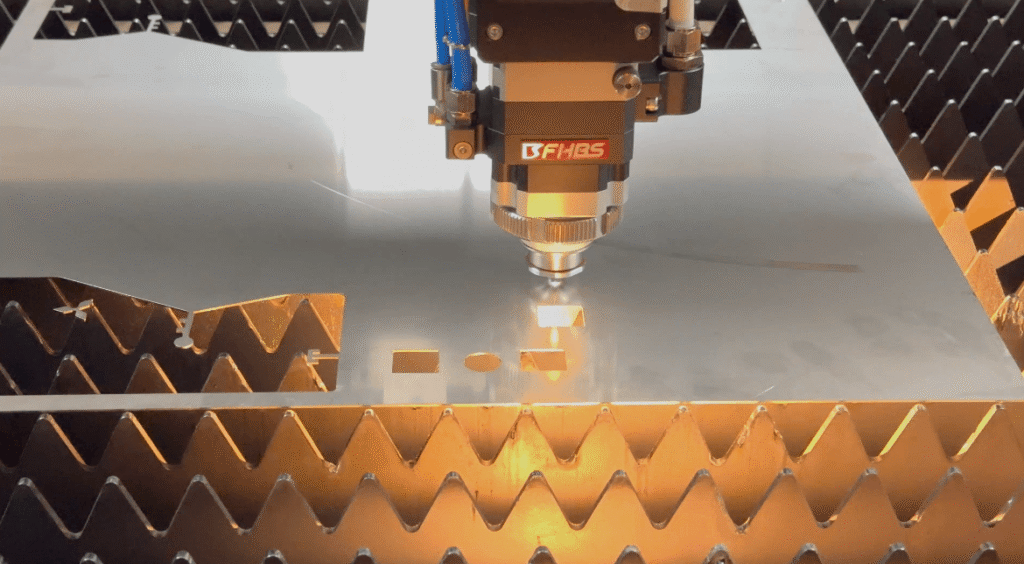 High-precision fiber laser cutter head processing a metal plate.