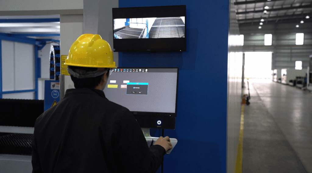 Laser cutter operator at workstation