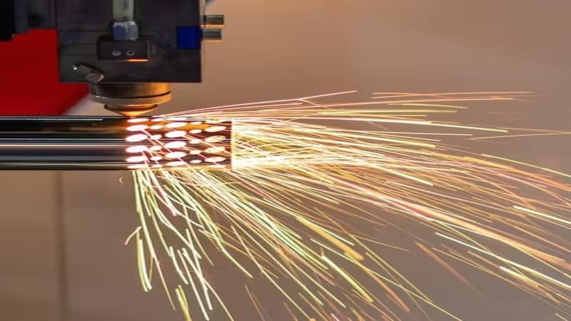 fiber laser cutting through a steel pipe