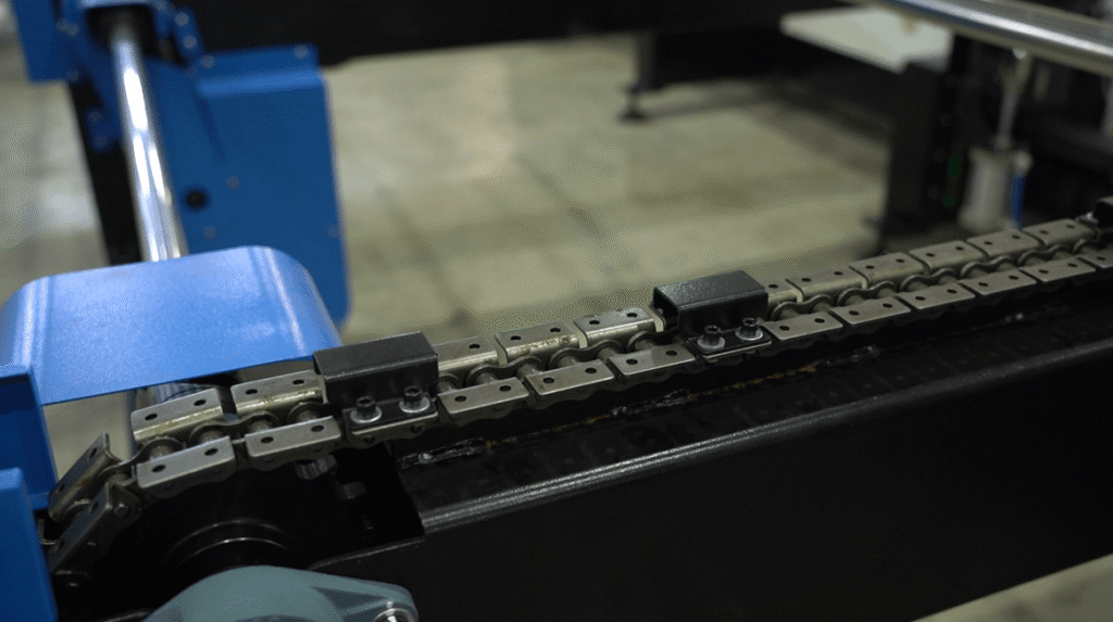 Close-up of automatic feeding chain on Baison laser pipe cutting machine