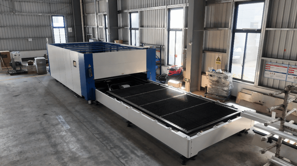 Large industrial shuttle table fiber laser cutting system.