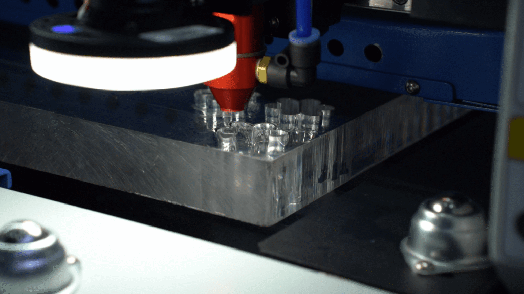 Precision laser cutting nozzle with intense light emission.