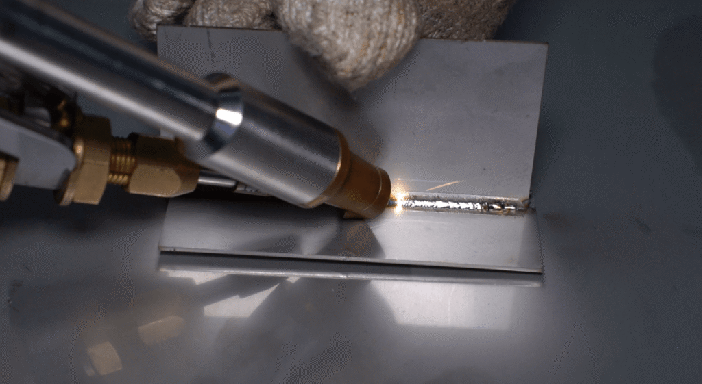 Multi-functional laser welding machine performing high-precision T-joint welding.