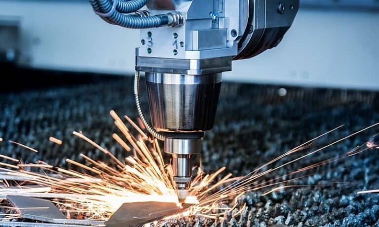 A laser machine cutting a piece of metal