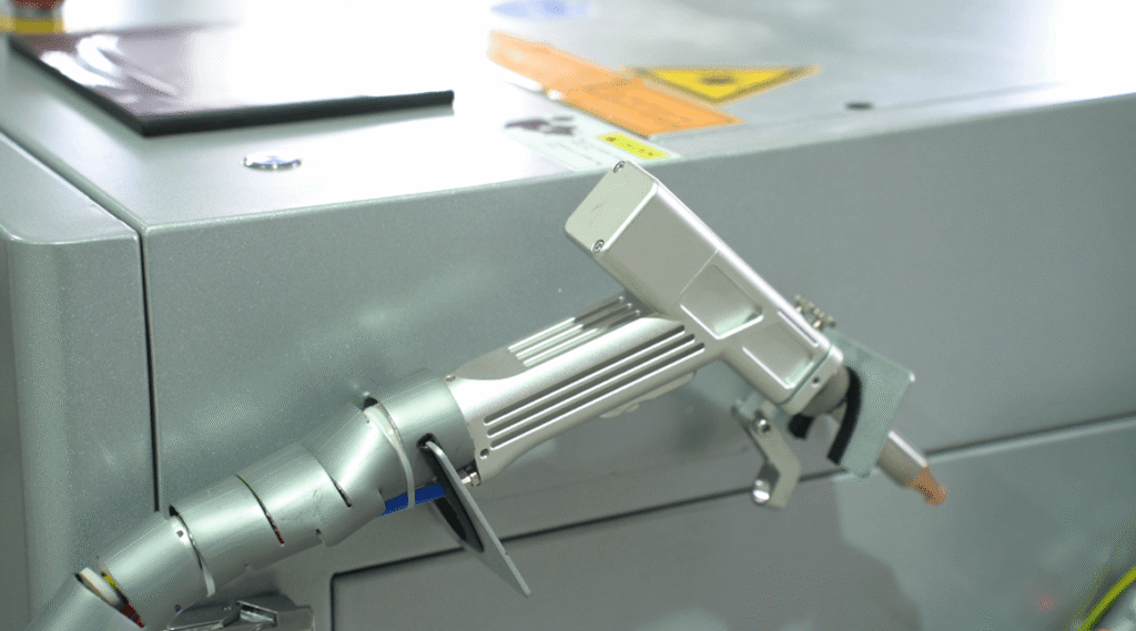 Handheld laser welding gun mounted on industrial laser welding machine