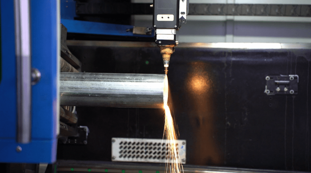 Manually assembling laser cut pipes.