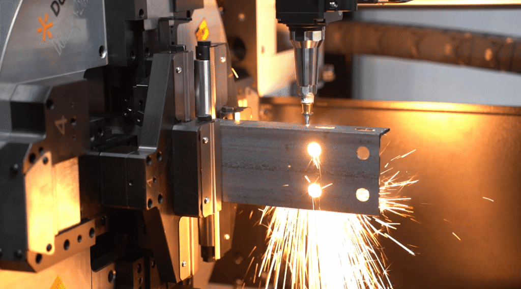 Fiber laser cutting rectangular steel tube with intense sparks.