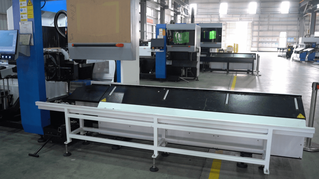 Automated plate-and-tube integrated laser cutting machine in a factory workshop.