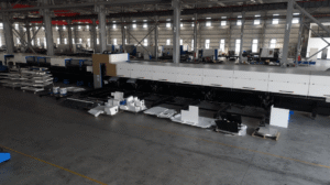Metal plate processing via adjusted laser cutting power