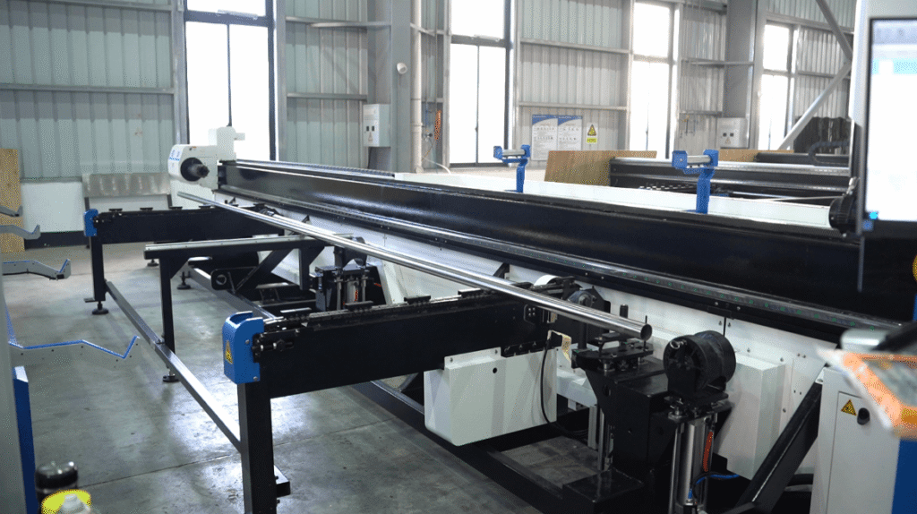 Ultra-long metal tube blanking on an industrial laser processing bed.