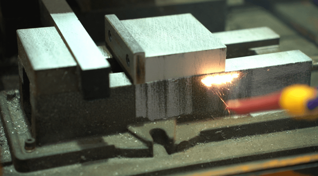 Precision metal block laser cleaning closeup