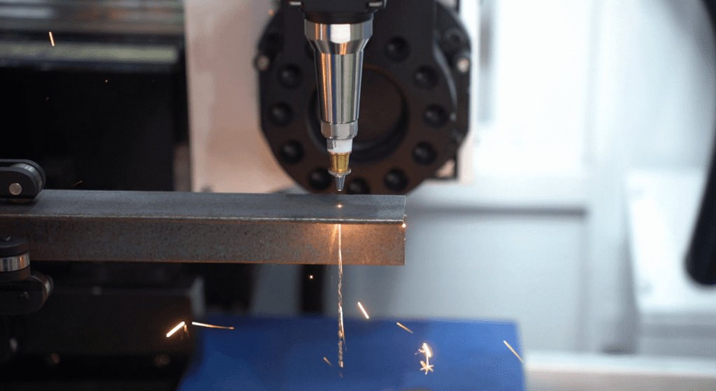 Industrial laser cutter cutting metal plate