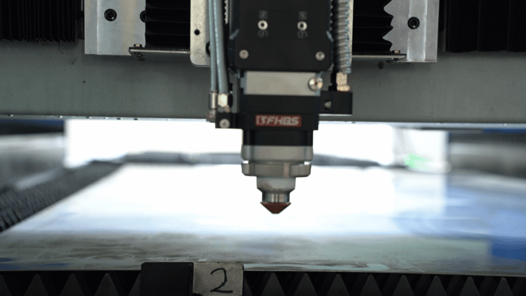 Close-up of a Baison Laser high-precision fiber cutting nozzle head.