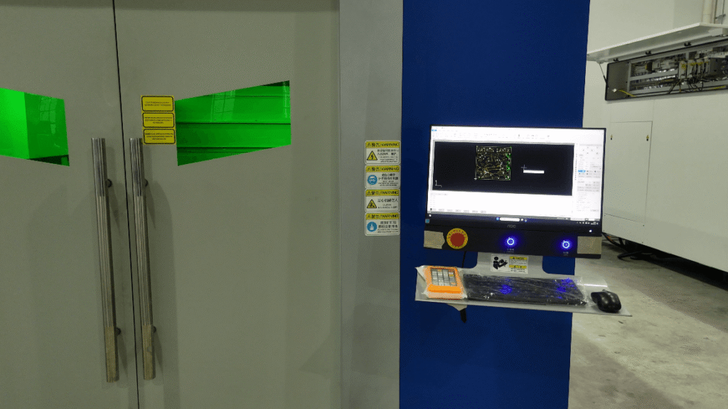 Industrial laser cutter control terminal displaying CypNest intelligent nesting software.