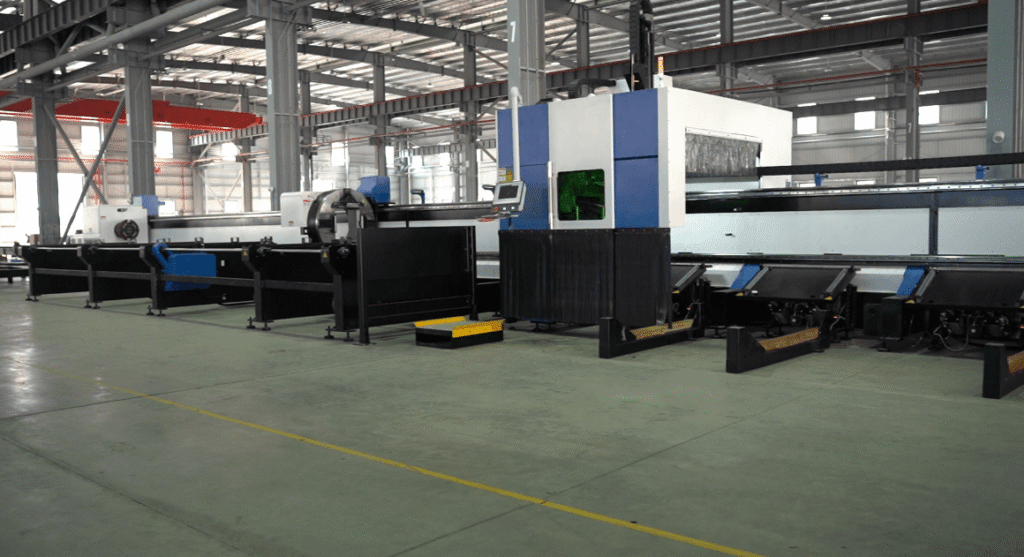 Large fully automated laser tube cutter in a workshop.