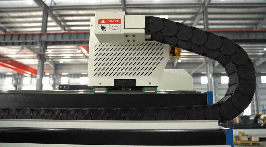 Industrial laser cutting system rail mechanism in a factory.