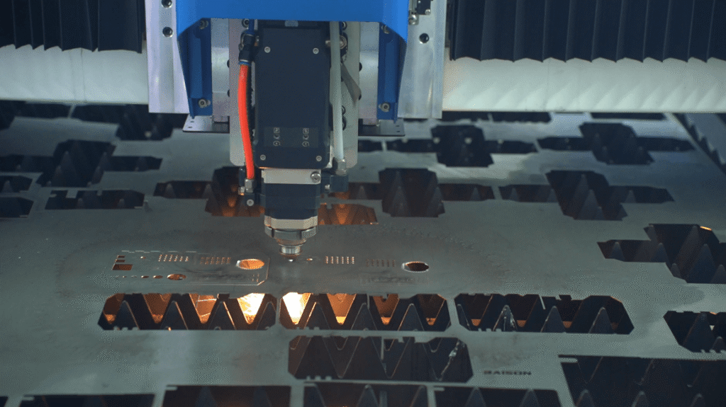 Baison fiber laser cutting head working on a steel plate.