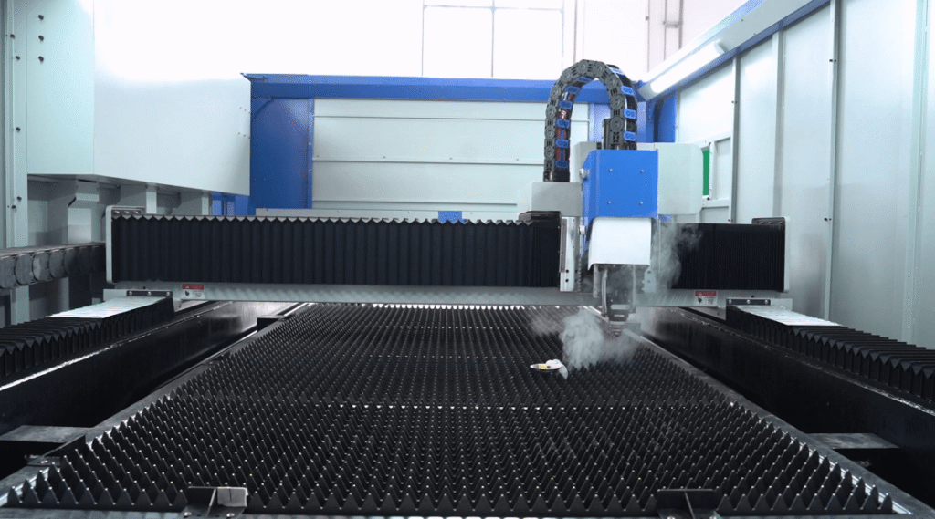 Laser gantry moving with smoke over the workbed.