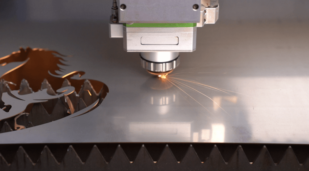 Intelligent laser head fly-cutting a horse pattern on metal sheet