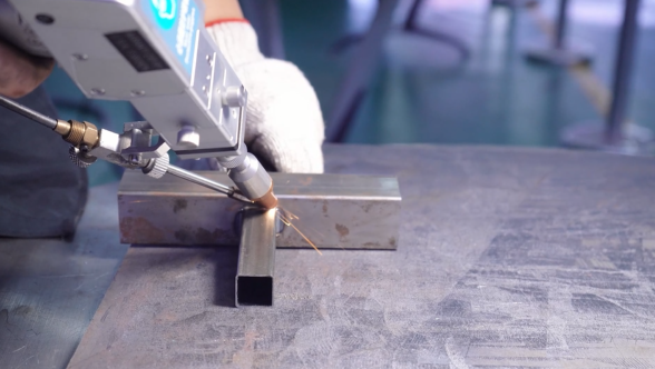 Long industrial tube laser cutting machine with full installation setup.