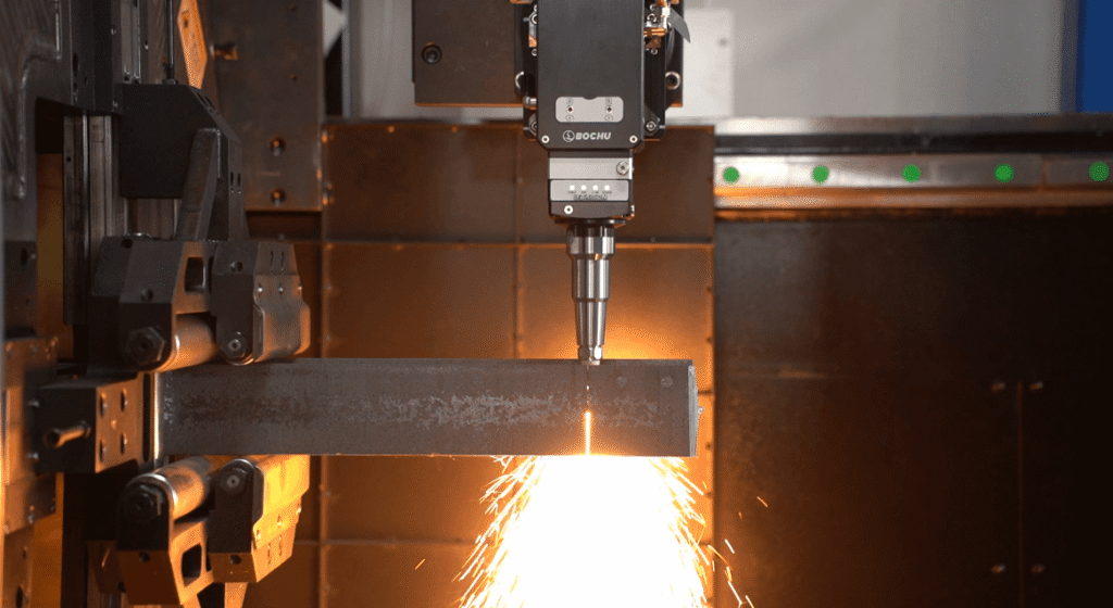 Bochu laser head piercing square steel tube with downward sparks.