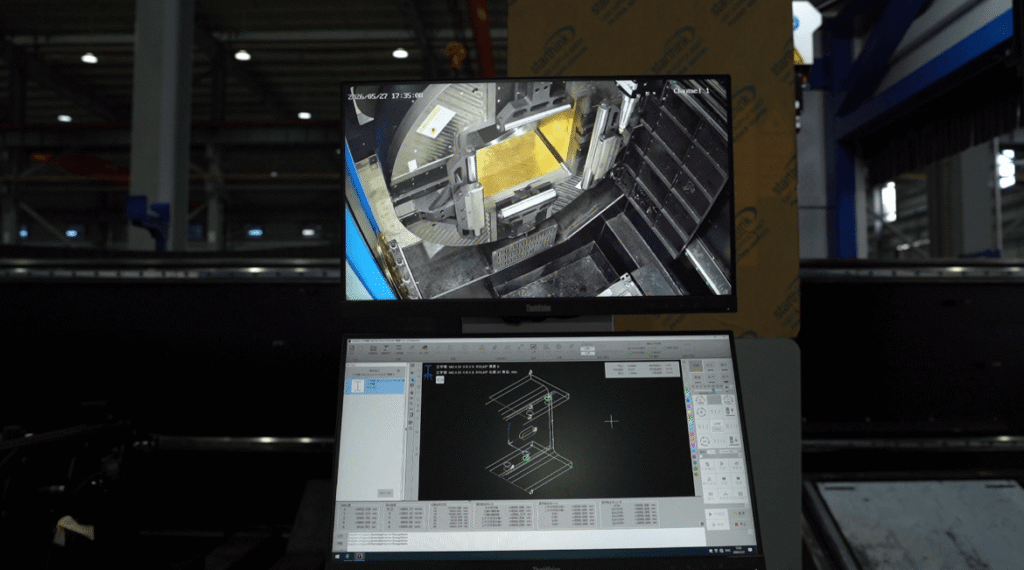 Laser head cutting H-beam edge with heavy sparks.