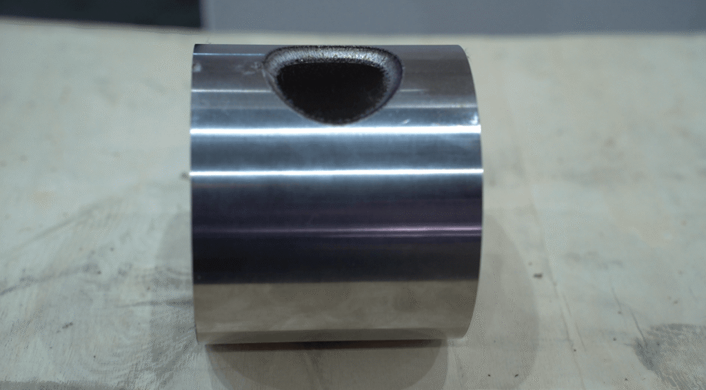 High precision laser cut metal part with smooth edge under 0.1mm tolerance.