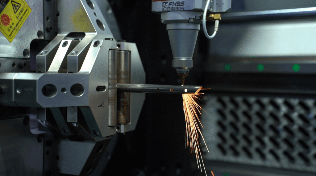 CNC laser tube cutting in progress