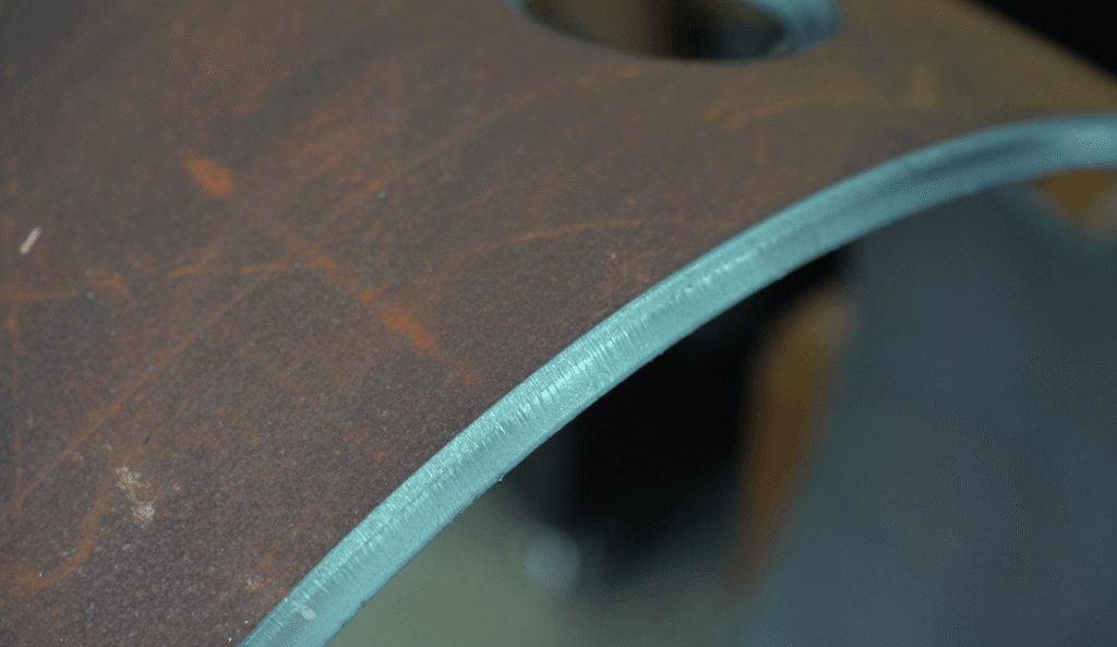 High-precision laser cut metal edge close-up