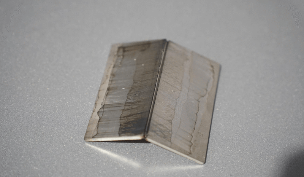 Finished laser-welded metal corner joint sample