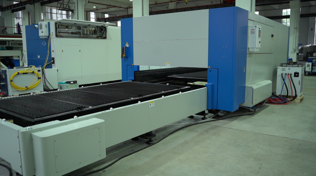 Industrial laser cutter with dual pallet exchange table