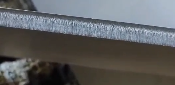 Detailed view of a smooth metal cut edge produced using the MAP Series Gas Mixing System.