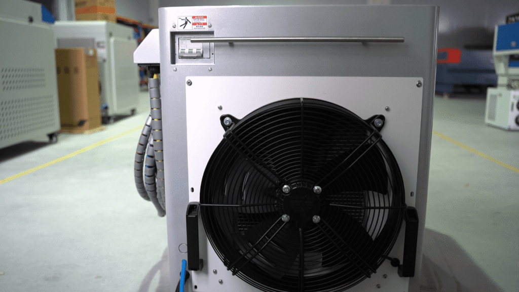 Close-up view of the large cooling fan on the laser cleaning machine.