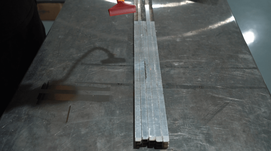 Laser cleaning system removing rust from narrow metal strips