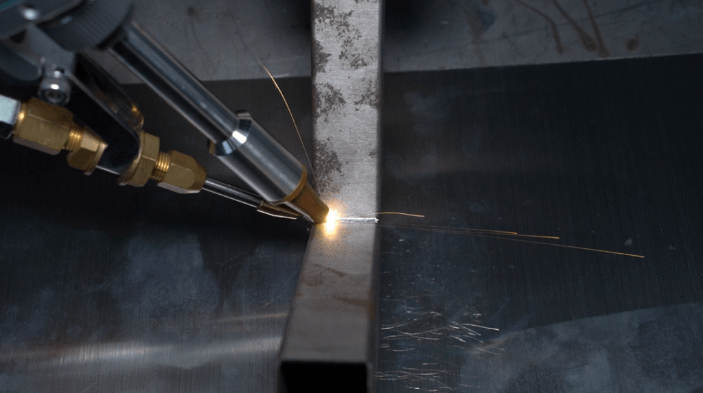 Laser welding a square metal tube close up