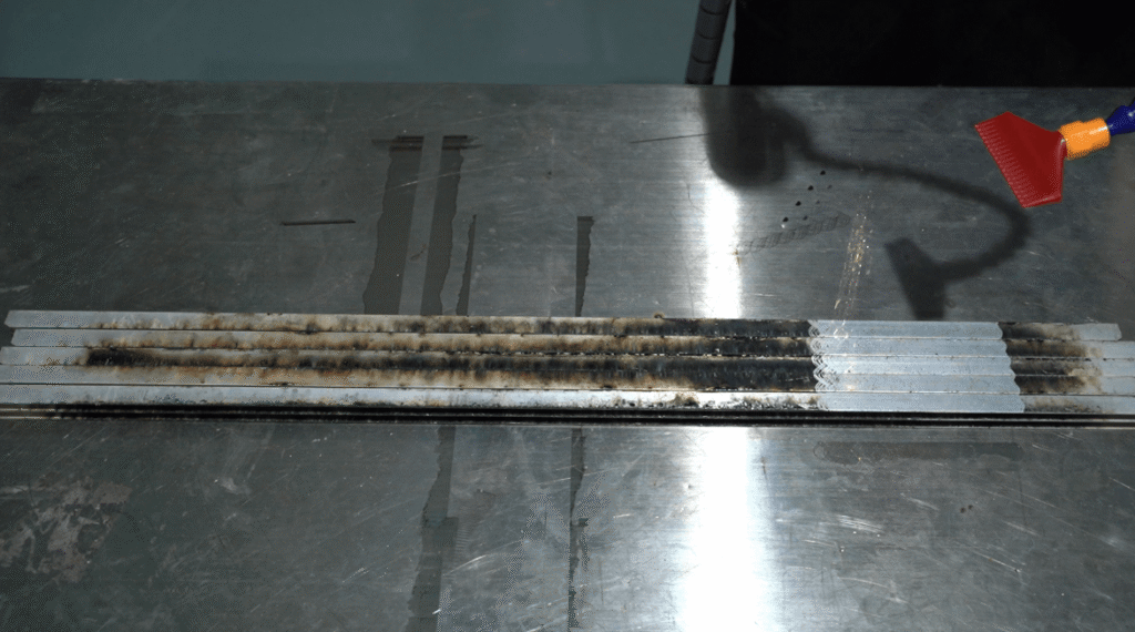 Laser cleaning system performing rust and oxide removal on metal