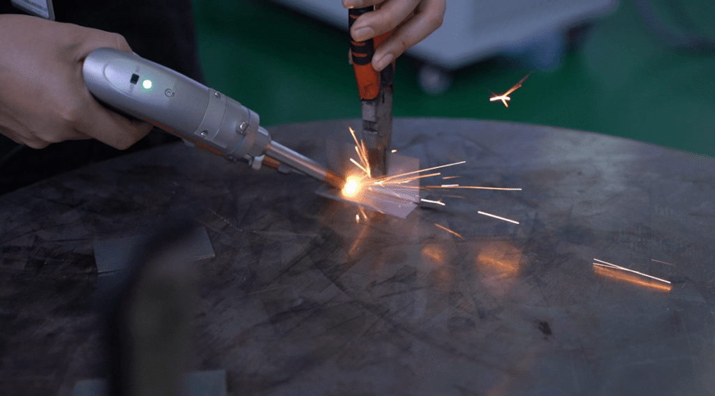 Spot welding process using a portable handheld laser welder