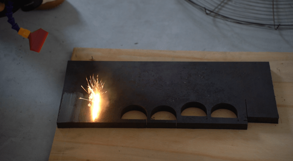 laser cutting metal plate with circular holes