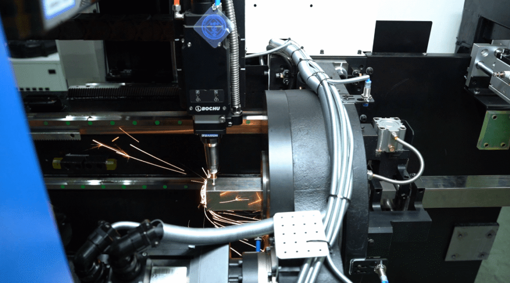 Laser cutting head actively cutting, sparks flying