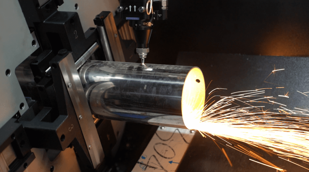 Laser cutting round metal pipe