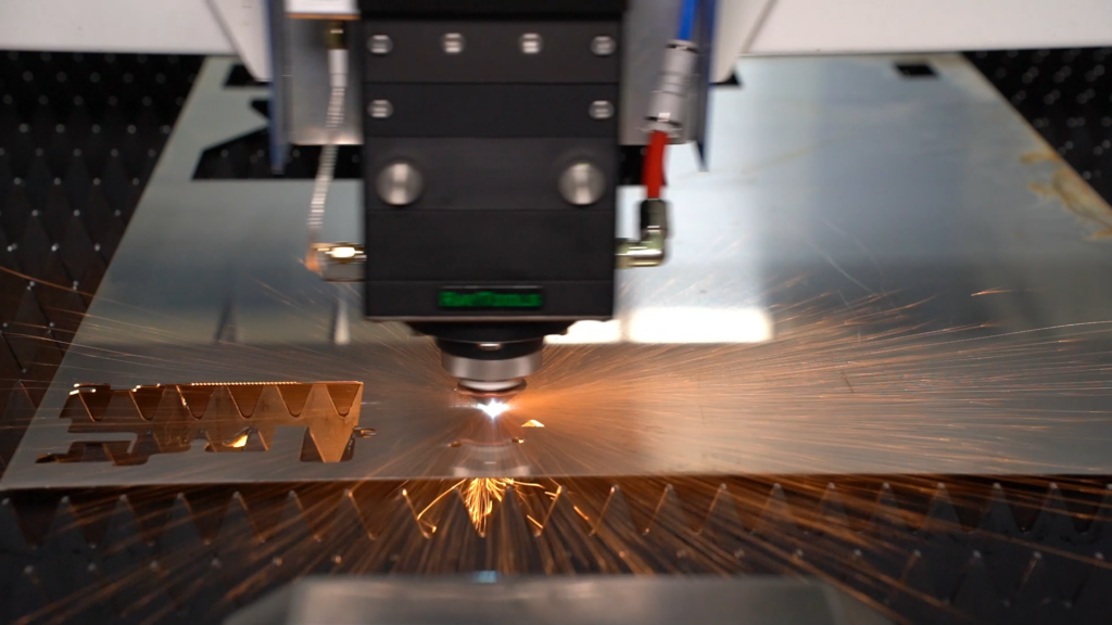 Fiber laser cutting head processing metal sheet
