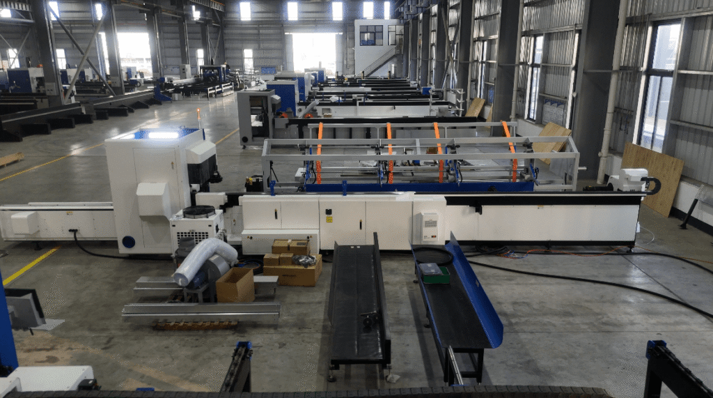 Rows of tube cutting machines in factory
