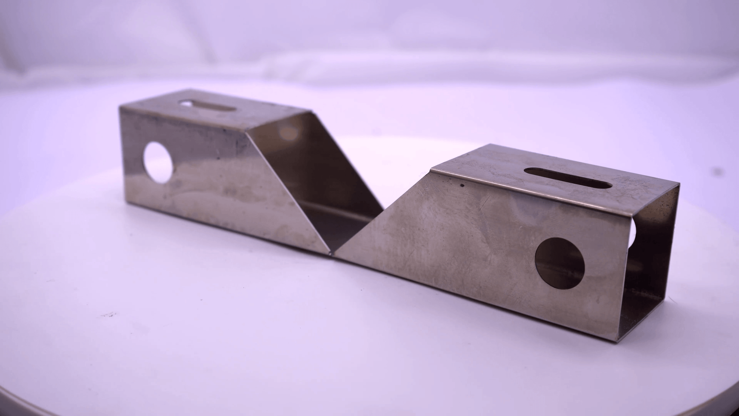 Precision square tube intersection and bevel cut sample processed by Baison G24 laser cutter.
