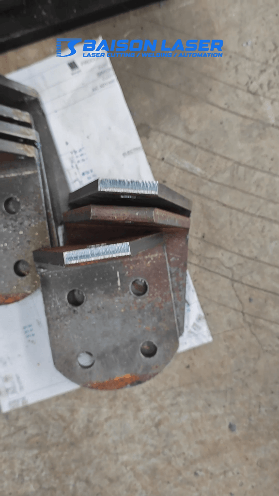 Clean laser cut edges and precision holes on heavy structural steel profile samples.